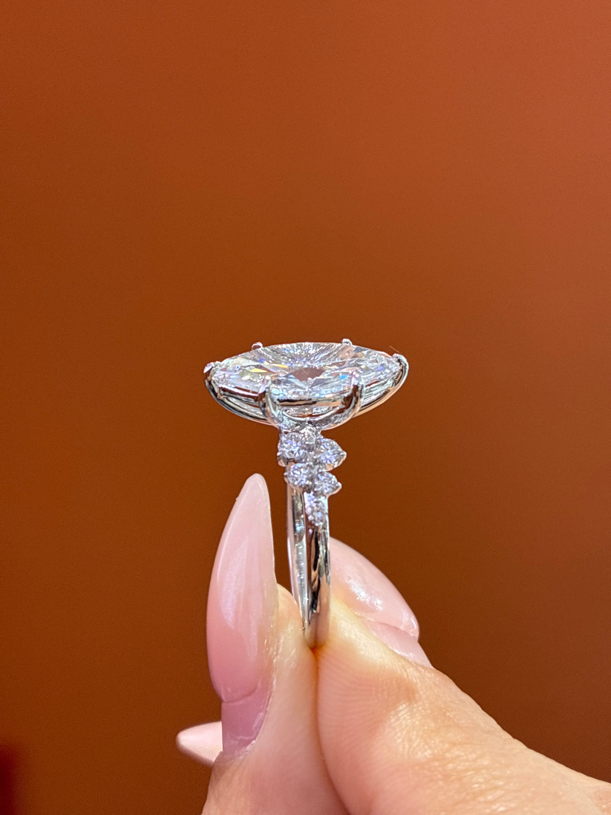 Deposit  for nicki 18k Marquise center stone, 5 carats, with approximately 0.33 carats of side stones, featuring a petal-style setting D/vvs2