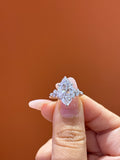 Deposit  for nicki 18k Marquise center stone, 5 carats, with approximately 0.33 carats of side stones, featuring a petal-style setting D/vvs2