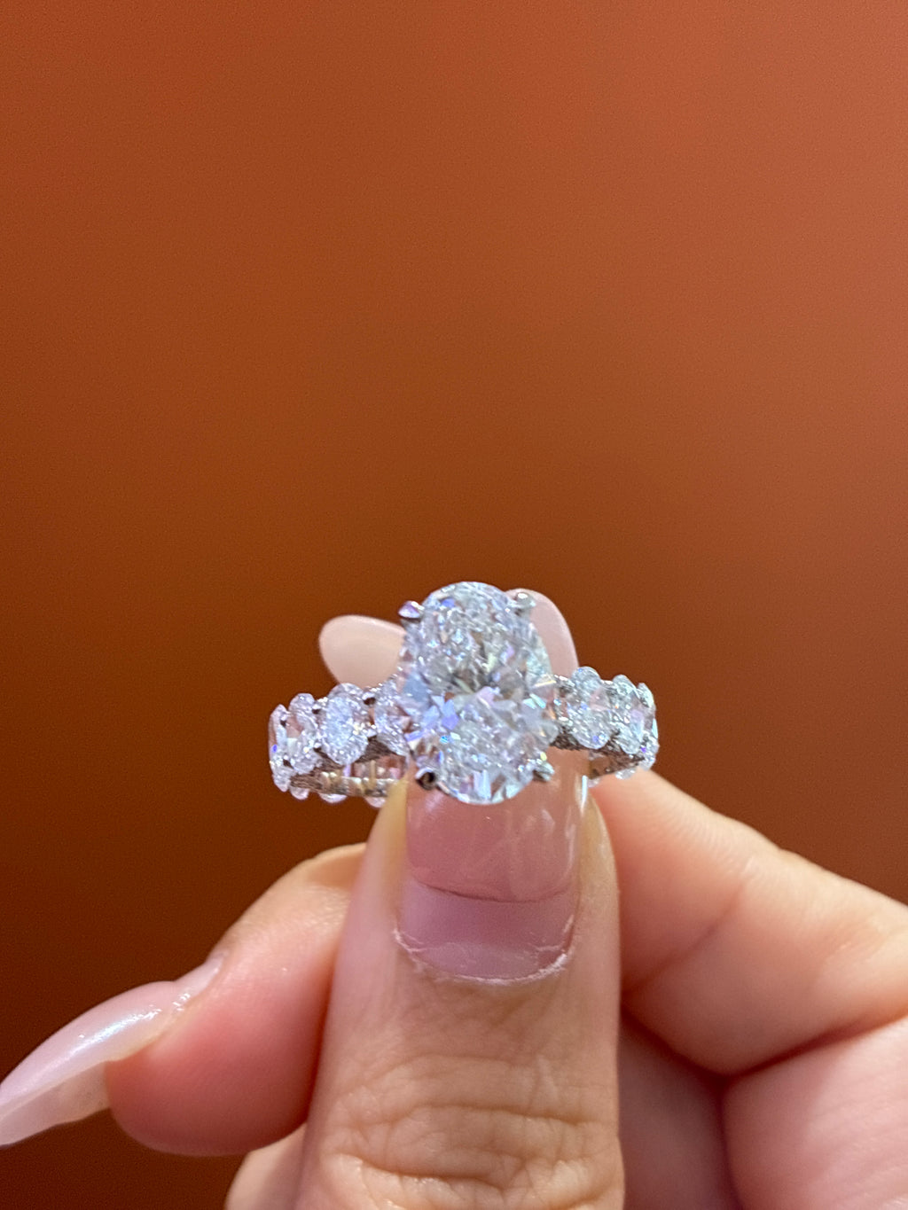 For Shaylyn — 18K White Gold, Oval-Cut White Diamond, center stone approximately 3.2 carats, side stones approximately 4.5 carats, D/VVS2.