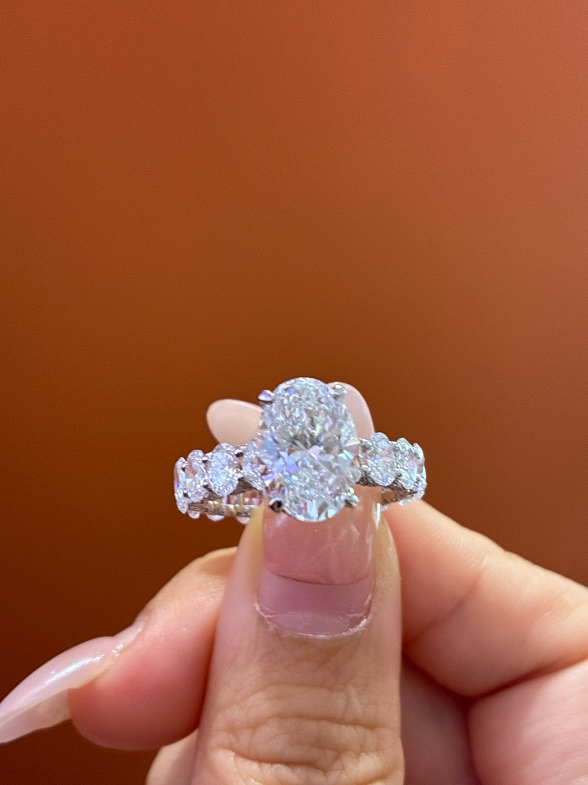 For Shaylyn — 18K White Gold, Oval-Cut White Diamond, center stone approximately 3.2 carats, side stones approximately 4.5 carats, D/VVS2.