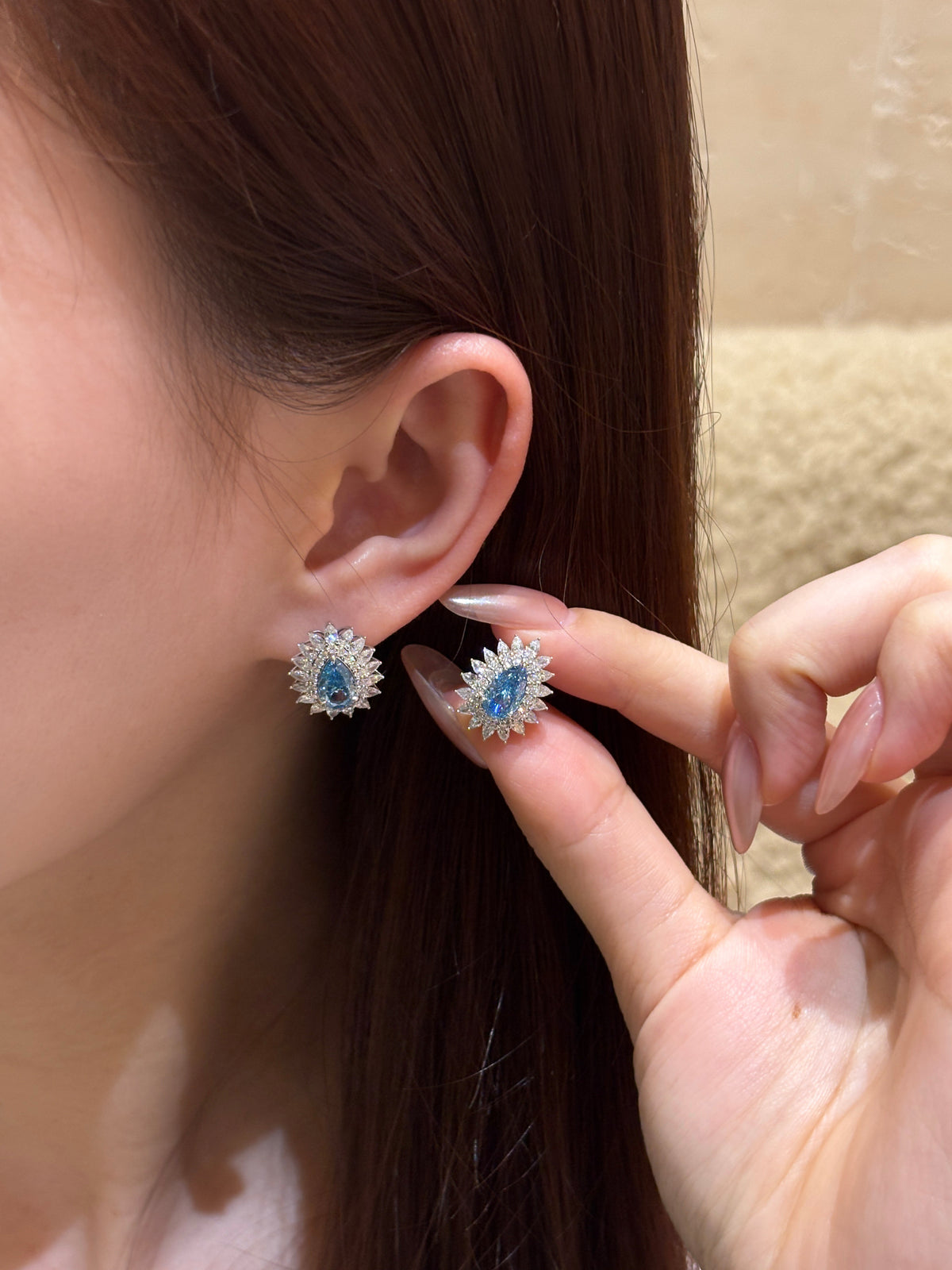 Pear Shaped Blue Diamond Stud Earrings | Halo Floral Setting | Diamond Accent Sunburst Design | 18K White Gold